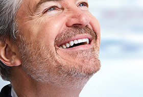 Older man with flawless smile