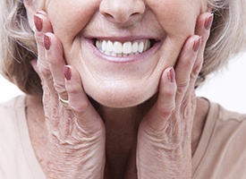 Closeup of woman smiling with dentures