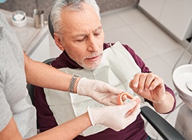 Man with dentures at the dentist