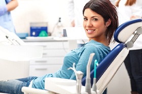 Smiling dental patient wearing a blue shirt