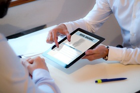 Dental insurance coordinator explaining benefits to a patient