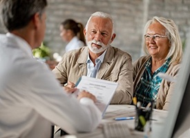 senior man and woman asking their dentist questions about dental implants in Pittsburgh 