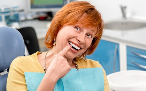 Woman in dental chair smiling