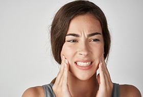 Woman with sore jaw, in need of custom nightguard