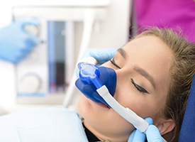 Woman relaxing with nitrous oxide dental sedation in Pittsburgh