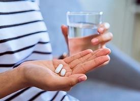 closeup of person taking oral sedative in Pittsburgh