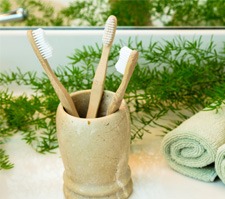 Toothbrushes in clay cup