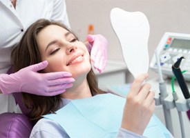 A woman who’s happy with her cosmetic dental results