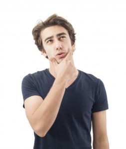 man puzzled finger on chin thinking