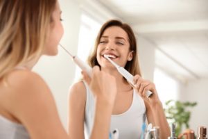 person brushing their teeth