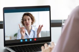 patient talking to their emergency dentist in Pittsburgh on their laptop