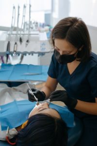 Dentist performing full mouth reconstruction