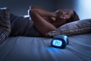 Woman struggling to get a good night’s rest because of sleep apnea