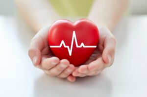 Close up of heart in palm of hands