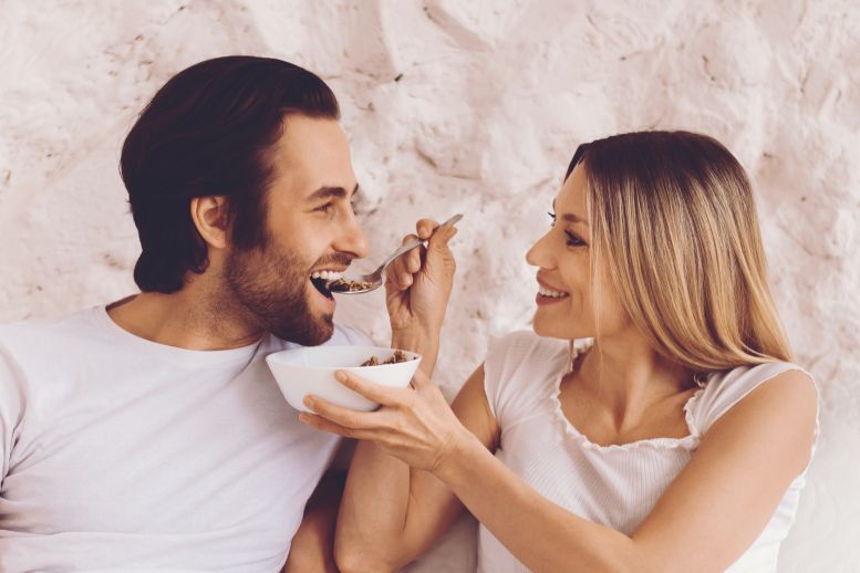 A couple sharing a spoon
